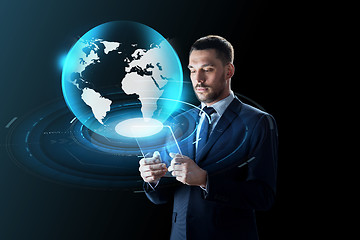 Image showing businessman with tablet pc and virtual globe