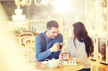 Image showing happy couple drinking tea at cafe