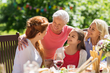 Image showing happy family having dinner or summer garden party