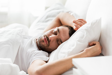 Image showing man sleeping in bed at home