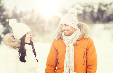 Image showing happy couple walking over winter background