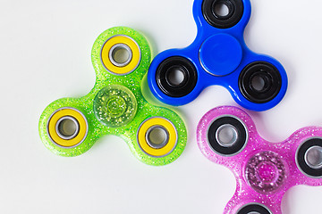 Image showing close up of fidget spinners on white background