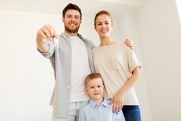 Image showing happy family with key moving to new home