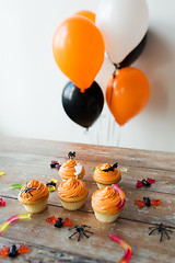 Image showing halloween party cupcakes and candies on table