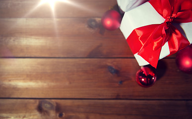 Image showing close up of gift boxes and red christmas balls