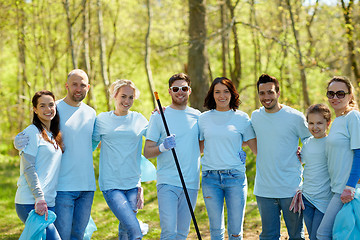 Image showing group of volunteers with garbage bags in park