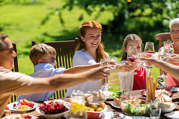 Image showing happy family having dinner or summer garden party