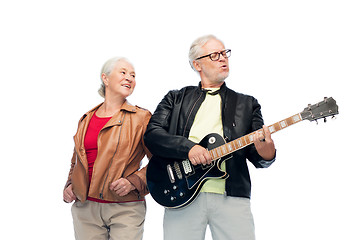 Image showing happy senior couple with electric guitar