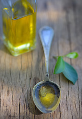 Image showing Spoon full of olive oil