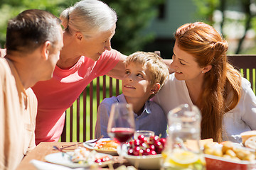 Image showing happy family having dinner or summer garden party