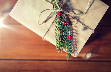 Image showing close up of christmas gift box with fir brunch