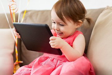 Image showing baby girl with tablet pc at home