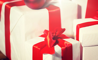 Image showing close up of gift boxes and red christmas balls