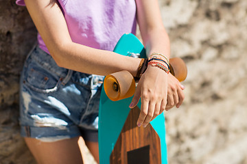 Image showing close up of teenage girl with longboard