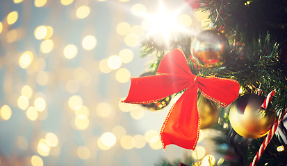 Image showing close up of red bow decoration on christmas tree