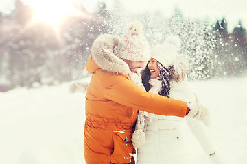 Image showing happy couple hugging and laughing in winter