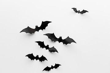 Image showing black paper bats over white background