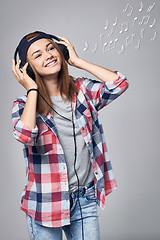 Image showing Teen girl listening enjoying music