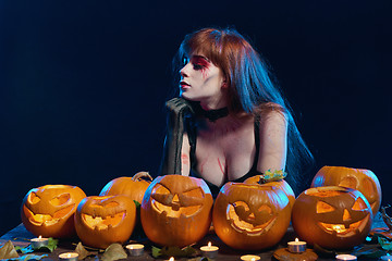 Image showing Woman with Halloween pumpkins