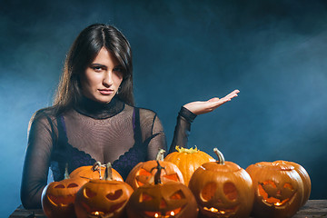 Image showing Woman with Halloween pumpkins