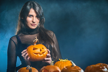 Image showing Woman with Halloween pumpkins