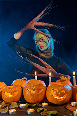 Image showing Halloween costume woman, tree girl with pumpkins