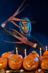 Image showing Halloween costume woman, tree girl with pumpkins