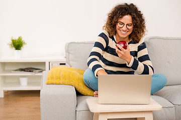 Image showing Beautiful woman working at home