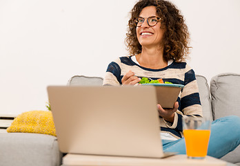 Image showing Beautiful woman eating a salad