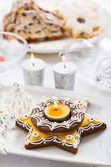 Image showing Decorated Christmas table with gingerbread candle