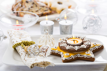 Image showing Decorated Christmas table with gingerbread candle