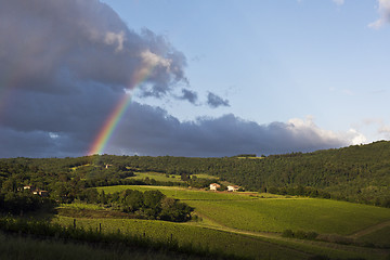 Image showing Evening landscape with rainbow. Tuscany, Italy