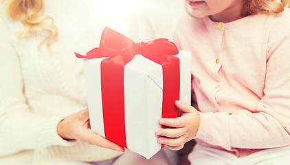 Image showing close up of mother and little girl with gift box