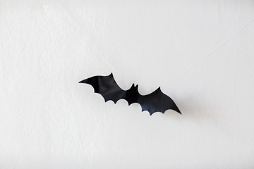 Image showing halloween decoration of bat hanging on strings