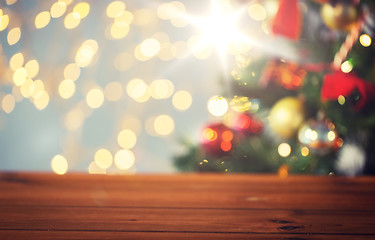 Image showing empty wooden surface over christmas tree lights