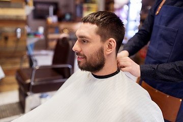 Image showing hairdresser and man with beard at barbershop