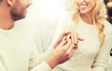 Image showing man giving diamond ring to woman for christmas