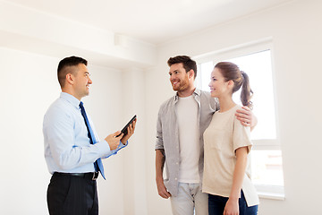 Image showing couple and realtor with tablet pc at new home