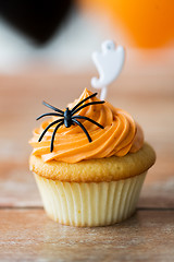 Image showing cupcake with halloween decoration on table