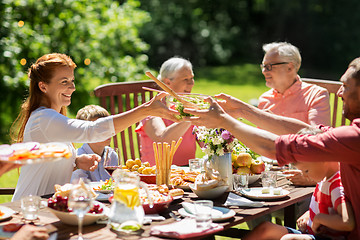 Image showing happy family having dinner or summer garden party