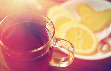 Image showing tea cup with lemon and ginger on plate