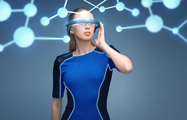 Image showing woman in virtual reality 3d glasses with molecules