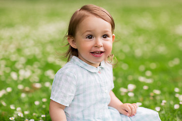 Image showing happy baby girl on green summer field