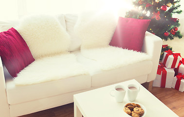 Image showing close up of christmas cookies and cups on table