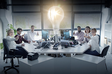 Image showing business team showing thumbs up at office