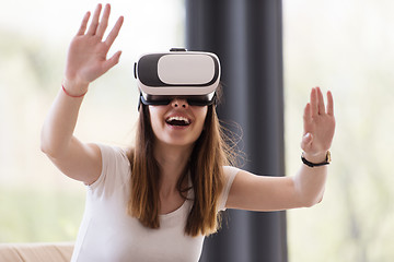 Image showing woman using VR-headset glasses of virtual reality