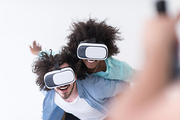 Image showing multiethnic couple getting experience using VR headset glasses