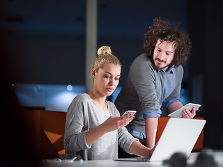 Image showing designers in the night startup office