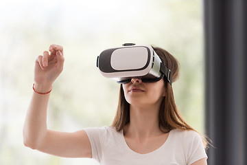 Image showing woman using VR-headset glasses of virtual reality