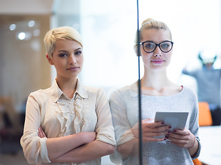 Image showing Pretty Businesswomen Using Tablet In Office Building during conf